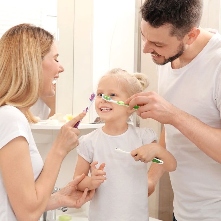 Ensuring Natural Health for Her Clan A caring mammy grinning with her wee ones, showcasing natural health