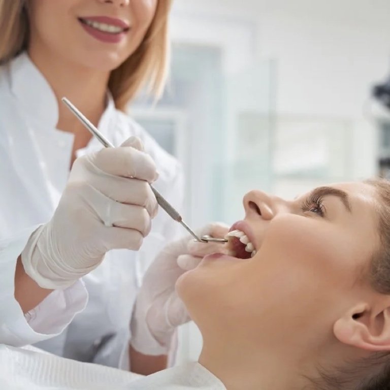 Welcoming Science-Laden Care for the Pearly Whites A contemplative woman poring over dental care research scrolls